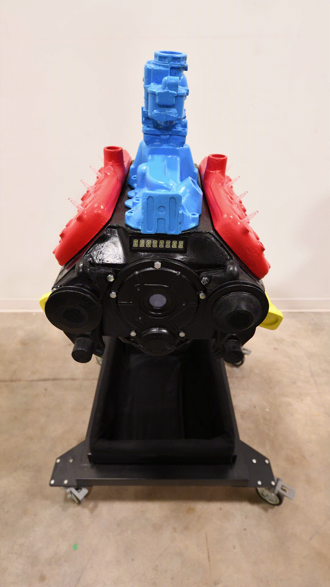 An animated image showing the Ford Flathead V-8 engine prototype from a variety of angles